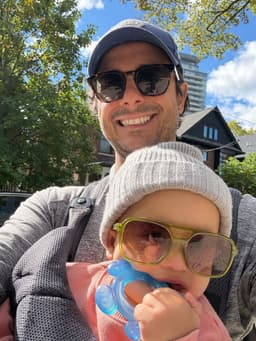 Jesse Karkoukly with his kid on a sunny walk in Toronto